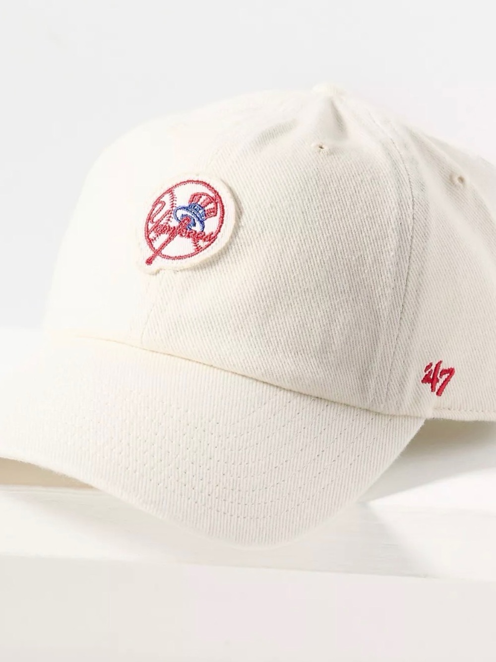 Anthropologie Cream Baseball Cap with Red & Blue Embroidered Logo
